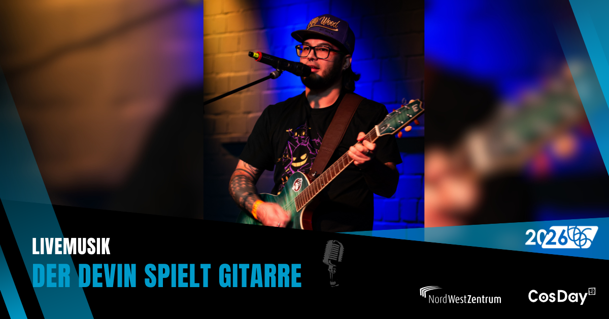 Der Devin spielt Gitarre auf der Bühne.